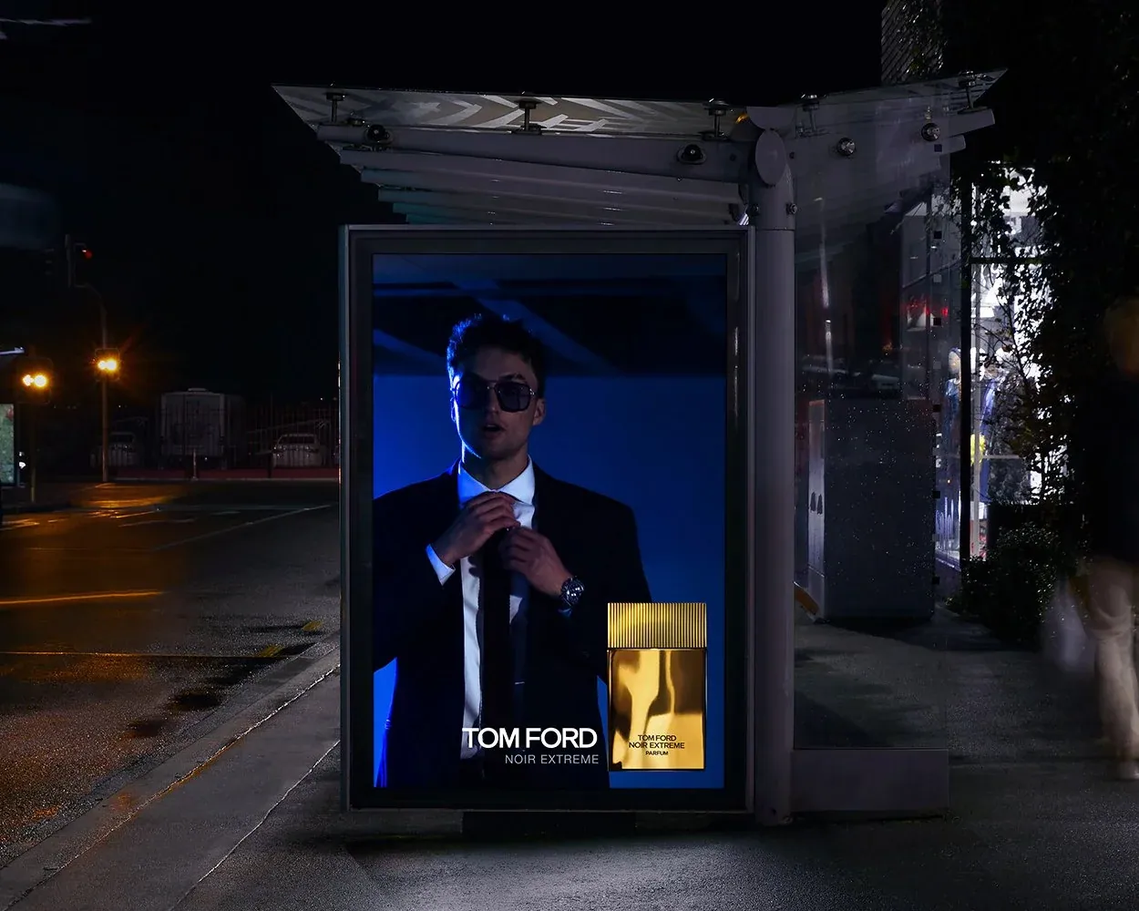 TOM FORD Noir Extreme concept poster in a bus shelter at night