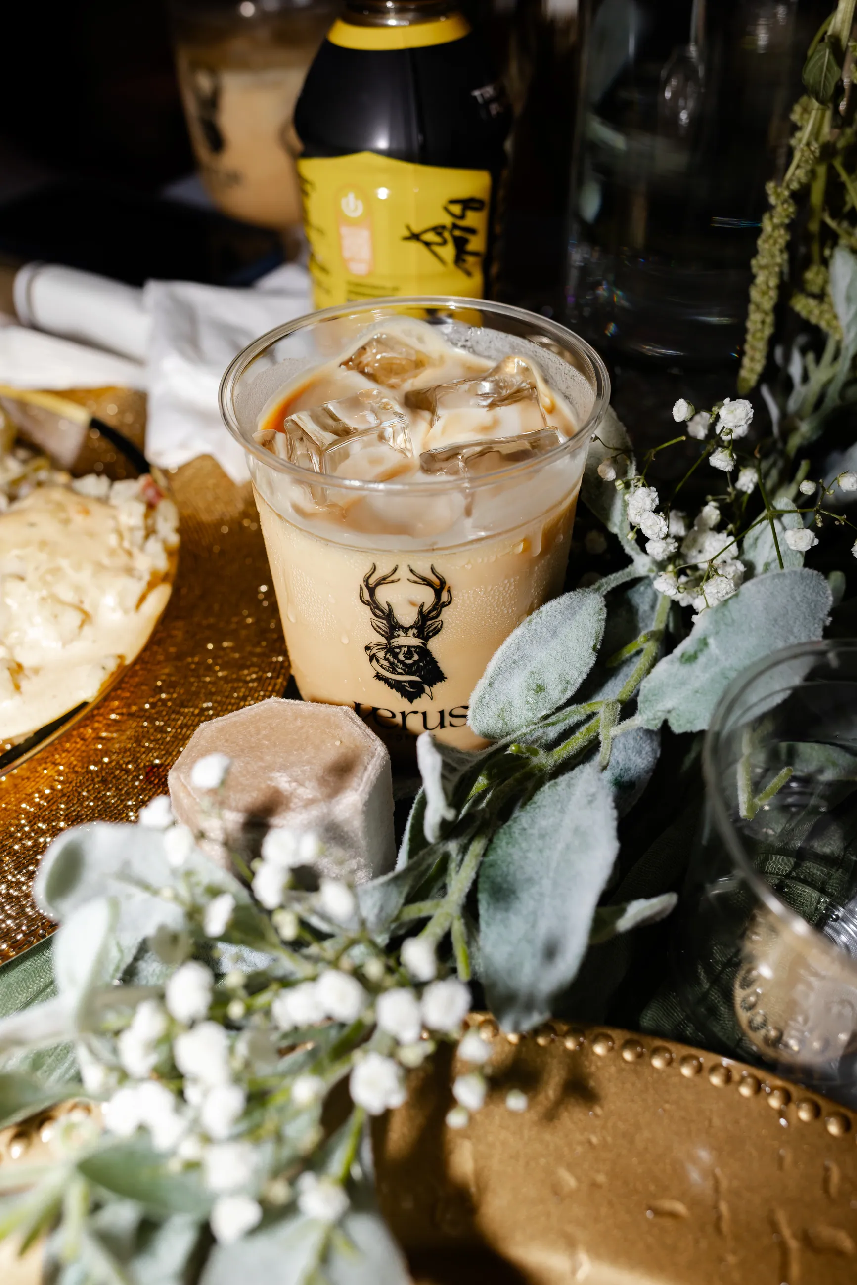 A Verus iced coffee beside flowers at a wedding